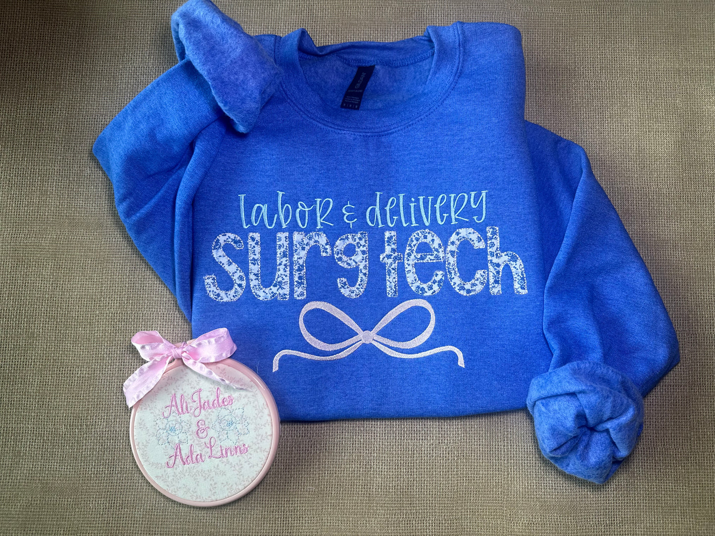 Floral appliqué Labor and Delivery, L&D surg tech embroidered bow tee or sweatshirt