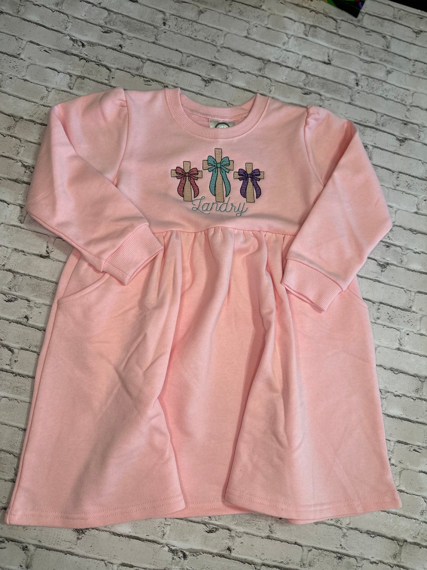 Cross with bow trio dresses