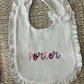 Embroidered name ruffle bib