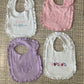 Embroidered name ruffle bib